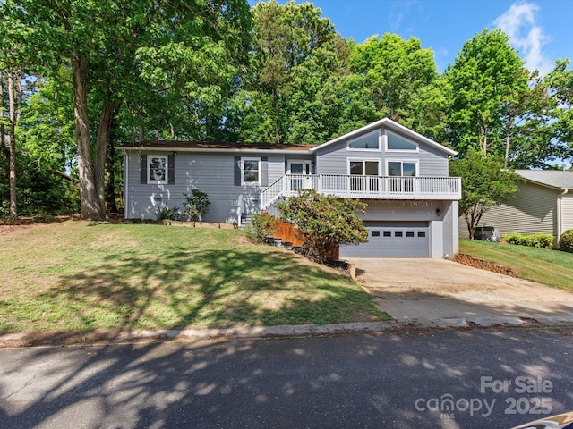 view of front facade featuring concrete driveway, a garage, and a front lawn