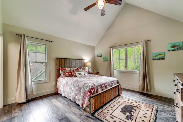 bedroom featuring baseboards, ceiling fan, high vaulted ceiling, and wood finished floors