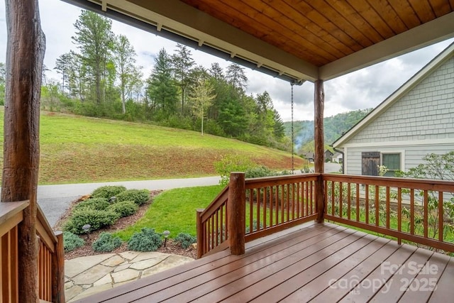 deck featuring a lawn