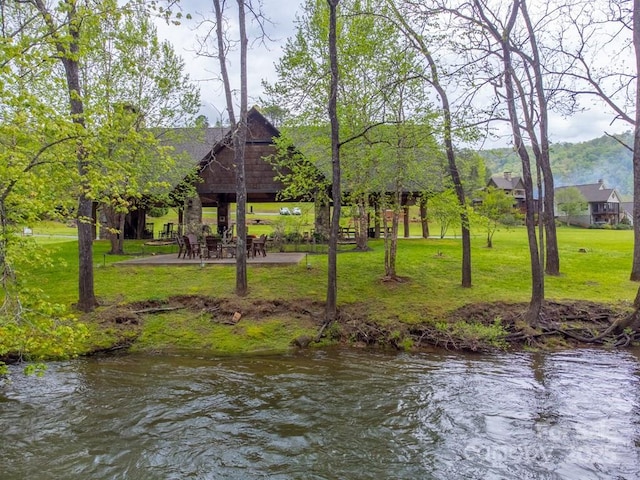view of property's community with a lawn and a gazebo