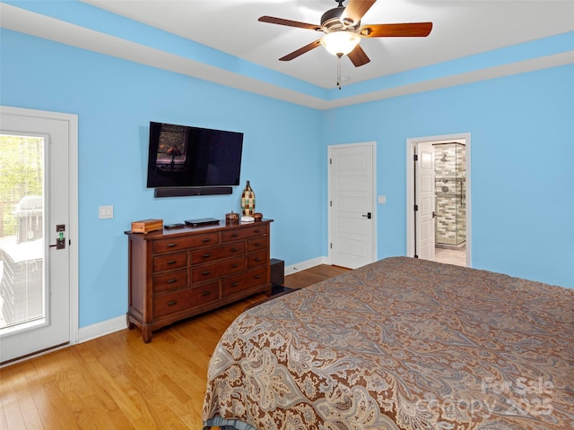 bedroom with baseboards, wood finished floors, and a ceiling fan
