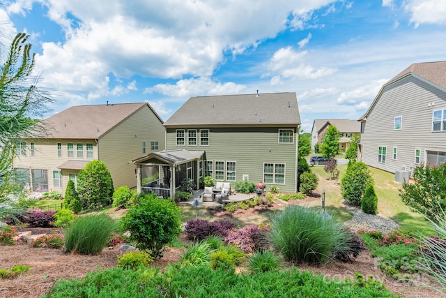 16507 Palisades Commons Dr, Charlotte, NC 28278 - back of house featuring a sunroom, central AC, and a patio