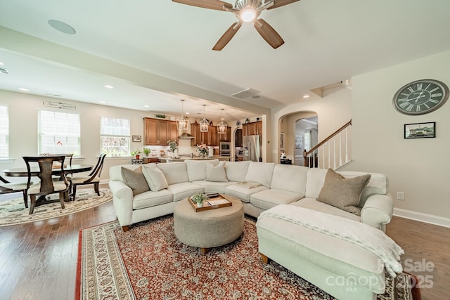 16507 Palisades Commons Dr, Charlotte, NC 28278 - living room with arched walkways, baseboards, dark wood-type flooring, a ceiling fan, and recessed lighting