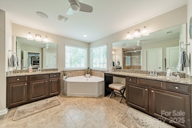 16507 Palisades Commons Dr, Charlotte, NC 28278 - full bathroom featuring ceiling fan, a stall shower, a garden tub, and two vanities