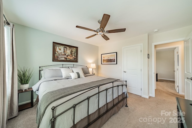 16507 Palisades Commons Dr, Charlotte, NC 28278 - bedroom with light colored carpet, baseboards, and a ceiling fan