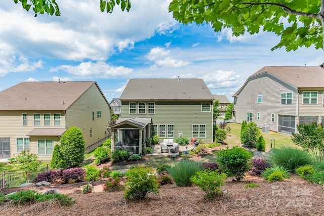 16507 Palisades Commons Dr, Charlotte, NC 28278 - back of property with a sunroom, a patio area, and a residential view