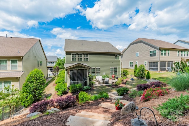 16507 Palisades Commons Dr, Charlotte, NC 28278 - rear view of house featuring a sunroom and an outdoor hangout area