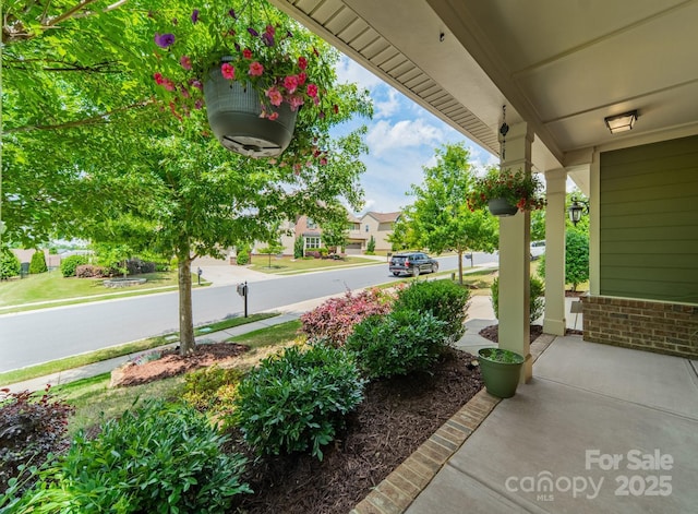 16507 Palisades Commons Dr, Charlotte, NC 28278 - view of patio / terrace with a porch and a residential view
