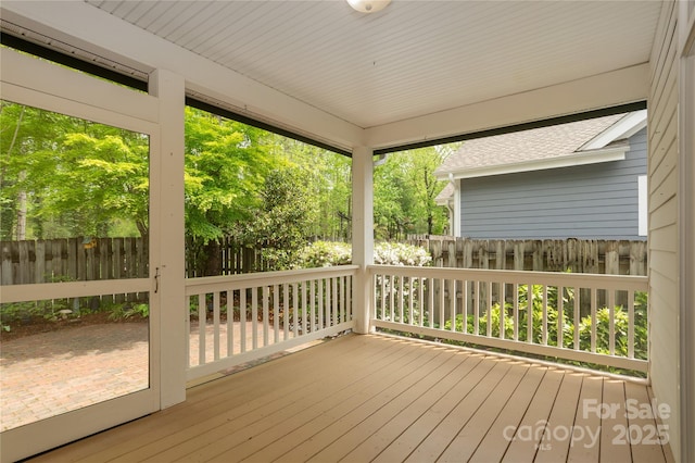 wooden deck featuring fence