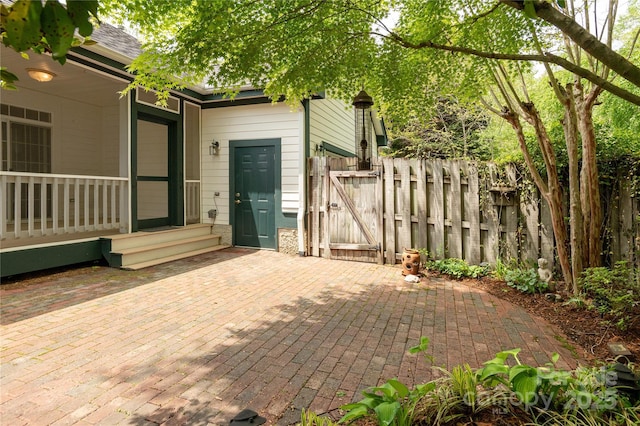 view of patio featuring a gate and fence