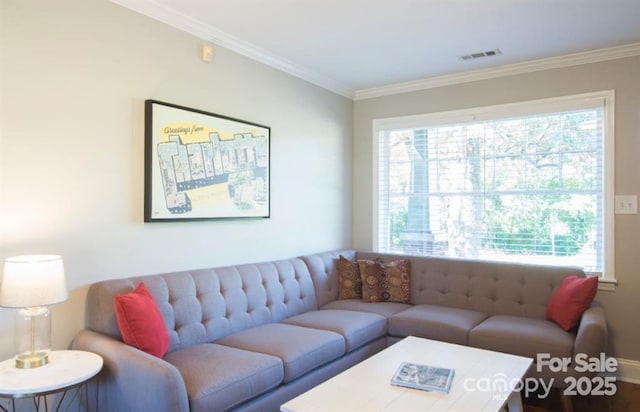 living room with visible vents and ornamental molding