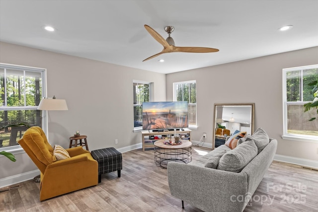 living room with visible vents, wood finished floors, baseboards, recessed lighting, and a ceiling fan