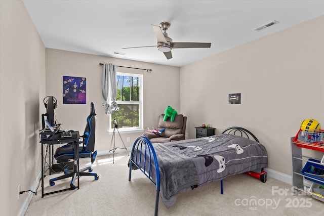 carpeted bedroom featuring visible vents, a ceiling fan, and baseboards