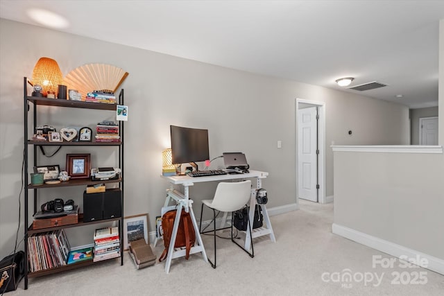 office space featuring baseboards, carpet, and visible vents
