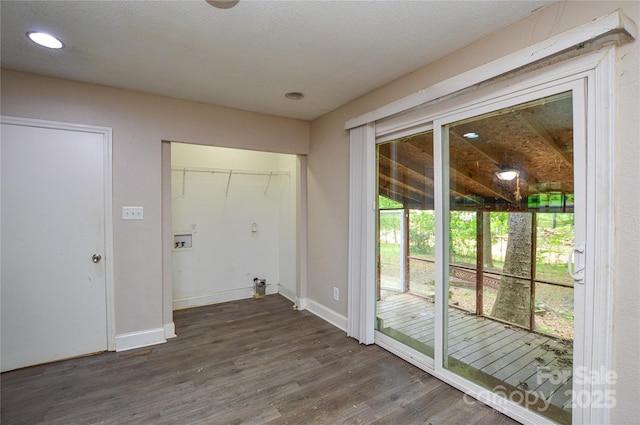 clothes washing area featuring wood finished floors, laundry area, recessed lighting, baseboards, and hookup for a washing machine