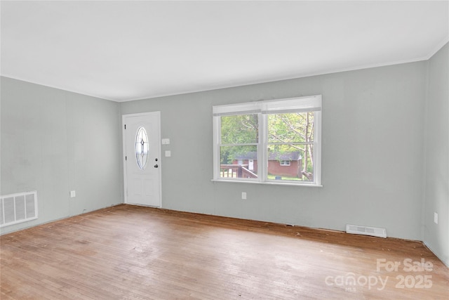 entrance foyer with visible vents and wood finished floors