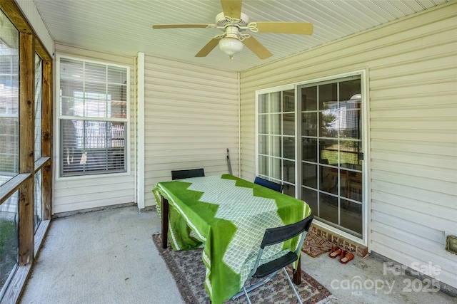 sunroom / solarium featuring ceiling fan
