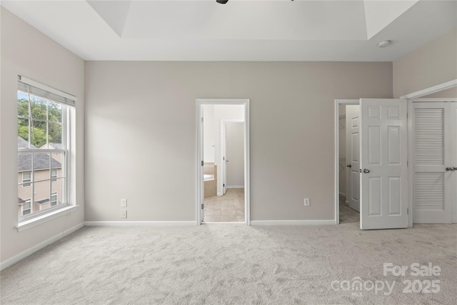 2151 Belle Vernon Ave, Charlotte, NC 28210 - unfurnished bedroom featuring carpet flooring, baseboards, a closet, and ensuite bathroom