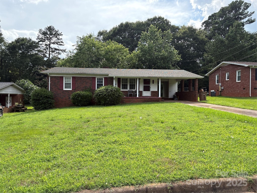 908 Mcgowan Rd, Shelby, NC 28150 - single story home featuring a front yard, brick siding, and covered porch