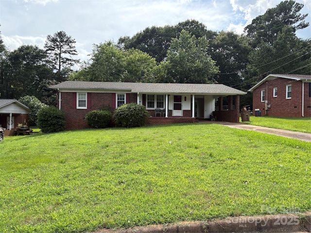 908 Mcgowan Rd, Shelby, NC 28150 - single story home featuring a front yard, brick siding, and covered porch