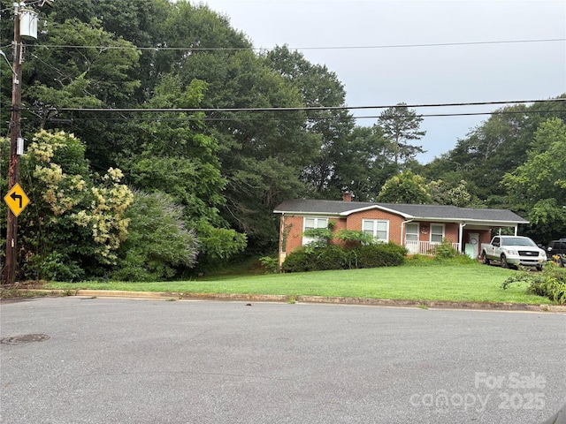 910 Mcgowan Rd, Shelby, NC 28150 - view of front of house with brick siding, a chimney, and a front yard