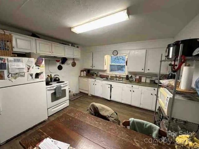 910 Mcgowan Rd, Shelby, NC 28150 - kitchen with white appliances, dark wood-style floors, white cabinetry, and range hood