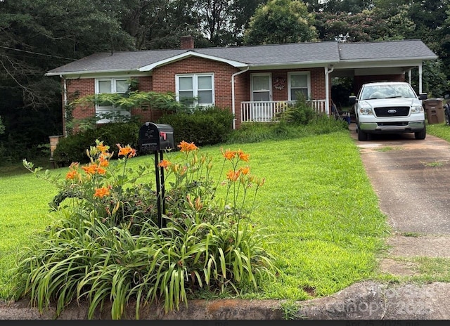 910 Mcgowan Rd, Shelby, NC 28150 - view of front of property with brick siding, covered porch, a front yard, an attached carport, and driveway