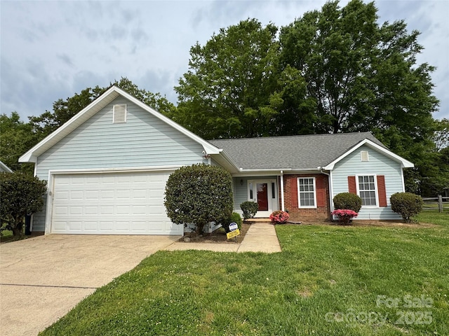 ranch-style home featuring a front yard, a garage, driveway, brick siding, and fence