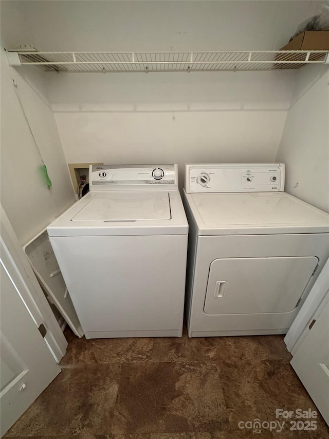 washroom with laundry area and independent washer and dryer