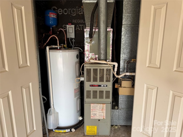 utility room with water heater
