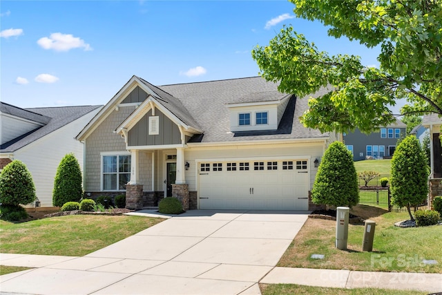 199 Blossom Ridge Dr, Mooresville, NC 28117 - craftsman inspired home with board and batten siding, a front yard, concrete driveway, and stone siding