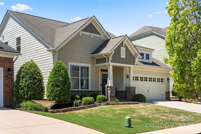199 Blossom Ridge Dr, Mooresville, NC 28117 - craftsman inspired home with board and batten siding, driveway, roof with shingles, a front yard, and stone siding