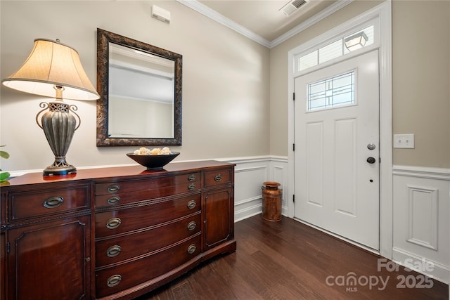 199 Blossom Ridge Dr, Mooresville, NC 28117 - foyer with crown molding, visible vents, wainscoting, and dark wood-type flooring