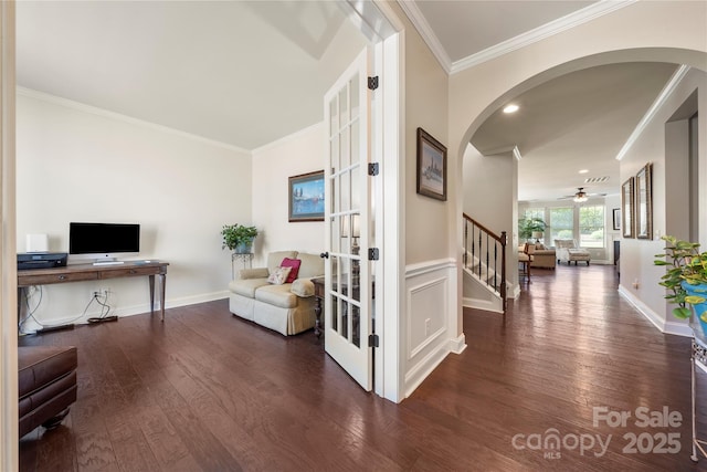 199 Blossom Ridge Dr, Mooresville, NC 28117 - interior space featuring arched walkways, dark wood finished floors, ornamental molding, and stairway