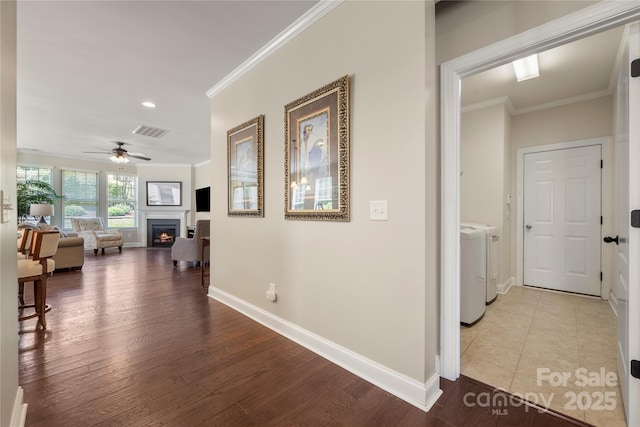 199 Blossom Ridge Dr, Mooresville, NC 28117 - hallway with crown molding, visible vents, baseboards, recessed lighting, and separate washer and dryer