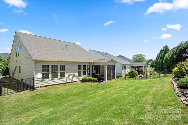 199 Blossom Ridge Dr, Mooresville, NC 28117 - back of property with a fenced backyard, a yard, a sunroom, and roof with shingles