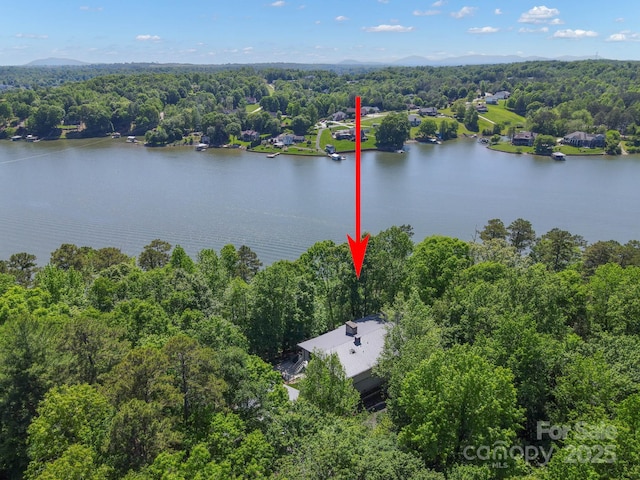 aerial view with a water view and a forest view