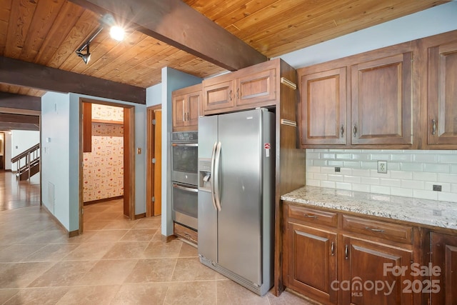 kitchen featuring beamed ceiling, appliances with stainless steel finishes, wooden ceiling, and tasteful backsplash