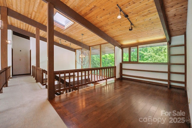 bonus room with wood-type flooring, an inviting chandelier, a wealth of natural light, and wood ceiling
