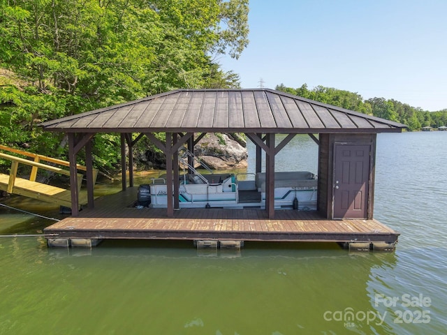 view of dock featuring a water view and a gazebo