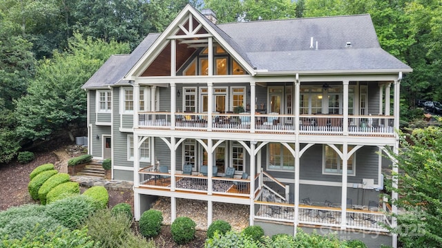 206 Stone Valley Way Unit 23, Hendersonville, NC 28792 - back of house with a balcony, a chimney, and roof with shingles