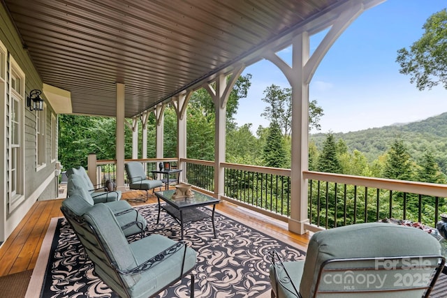 206 Stone Valley Way Unit 23, Hendersonville, NC 28792 - wooden deck with an outdoor living space and a forest view