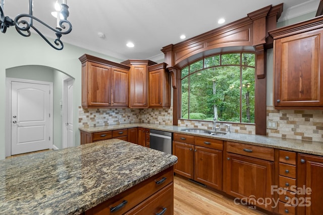 206 Stone Valley Way Unit 23, Hendersonville, NC 28792 - kitchen with stainless steel dishwasher, dark stone countertops, arched walkways, backsplash, and recessed lighting