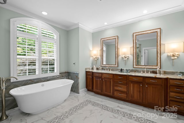 206 Stone Valley Way Unit 23, Hendersonville, NC 28792 - full bathroom featuring double vanity, a soaking tub, a wainscoted wall, marble finish floors, and crown molding