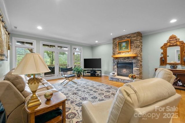 206 Stone Valley Way Unit 23, Hendersonville, NC 28792 - living area featuring plenty of natural light, wood finished floors, a fireplace, recessed lighting, and crown molding