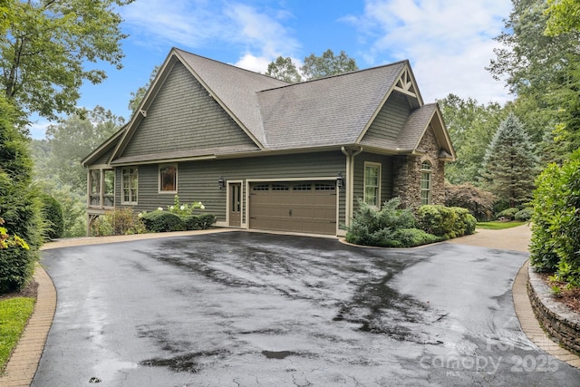 206 Stone Valley Way Unit 23, Hendersonville, NC 28792 - view of side of home featuring driveway, a garage, stone siding, and roof with shingles