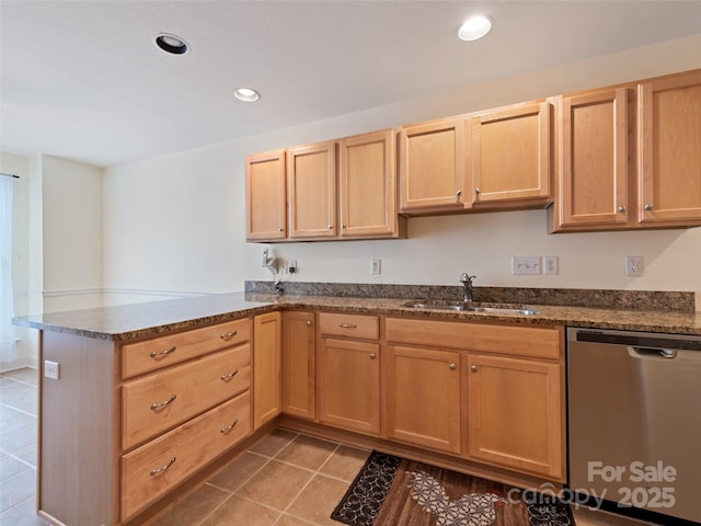 kitchen featuring a sink, dishwasher, a peninsula, recessed lighting, and light tile patterned floors