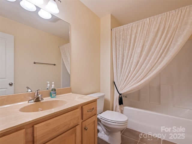 bathroom featuring toilet, shower / bath combo with shower curtain, tile patterned flooring, and vanity