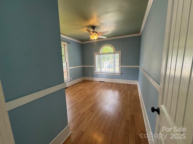 1019 Valley St, Kannapolis, NC 28081 - empty room featuring wood finished floors, ceiling fan, ornamental molding, and baseboards