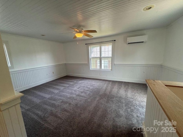 1019 Valley St, Kannapolis, NC 28081 - unfurnished room with an AC wall unit, a wainscoted wall, a ceiling fan, and carpet flooring
